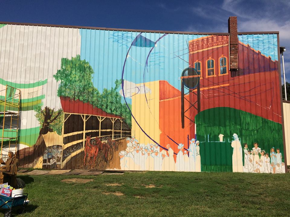 A mural painted on the side of a building.