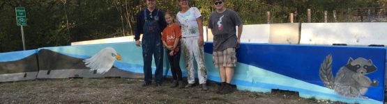 Four individuals standing for a group picture