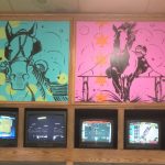 Pink and green wall paintings of horses
