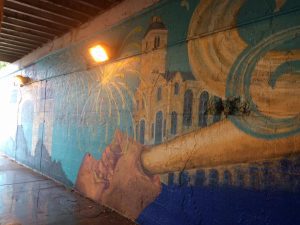 Wall painting of a bat and hands