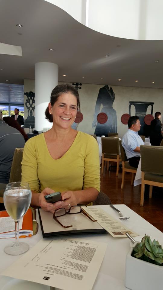 A woman sitting in a restaurant