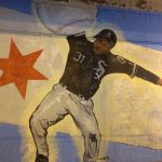 A baseball player and a star painting on a wall