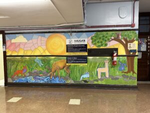Colorful mural with animals and nature scene.