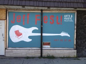 Guitar painting on a shop window