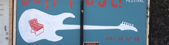 Guitar painting on a shop window