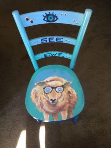 A sheep painted on a kid’s chair