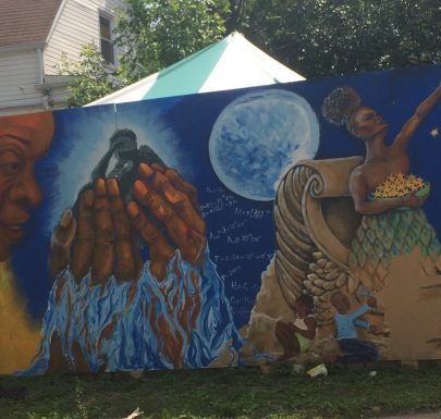 A mural painted on the side of a building.