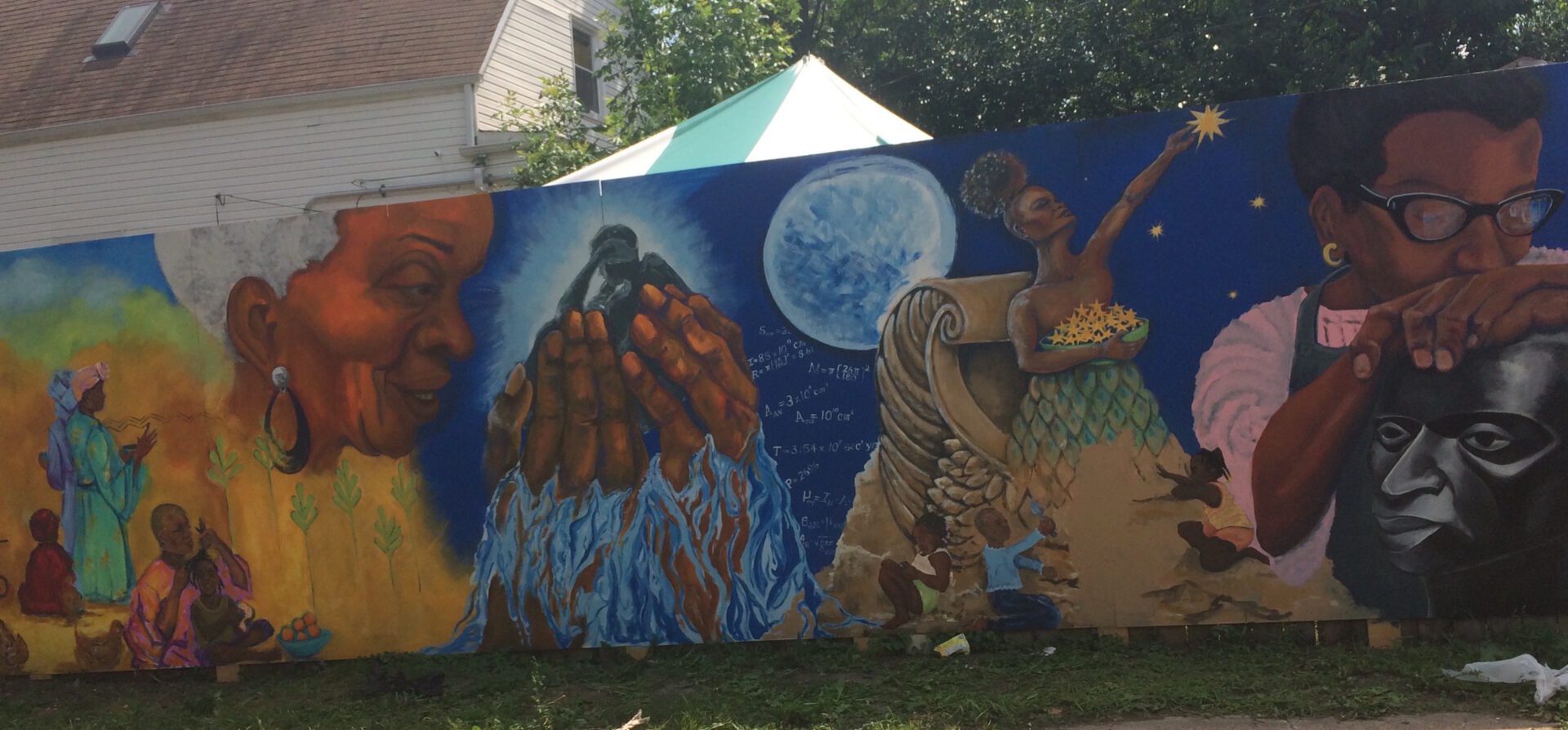 A mural painted on the side of a building.