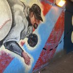 A ball and a baseball player wall painting