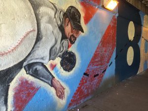 A ball and a baseball player wall painting