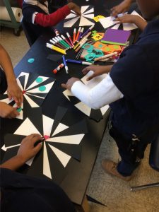 Kids sketching on a table