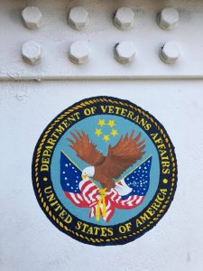 Department of Veterans Affairs logo on a white pillar