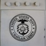 United States Navy Chaplain Corps logo on a white pillar