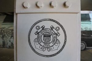 United States Coast Guard 1790 logo on a white pillar