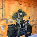 Painting of a man on a bike
