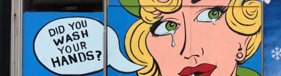 A mural on the side of a building that says did you wash your hands?.