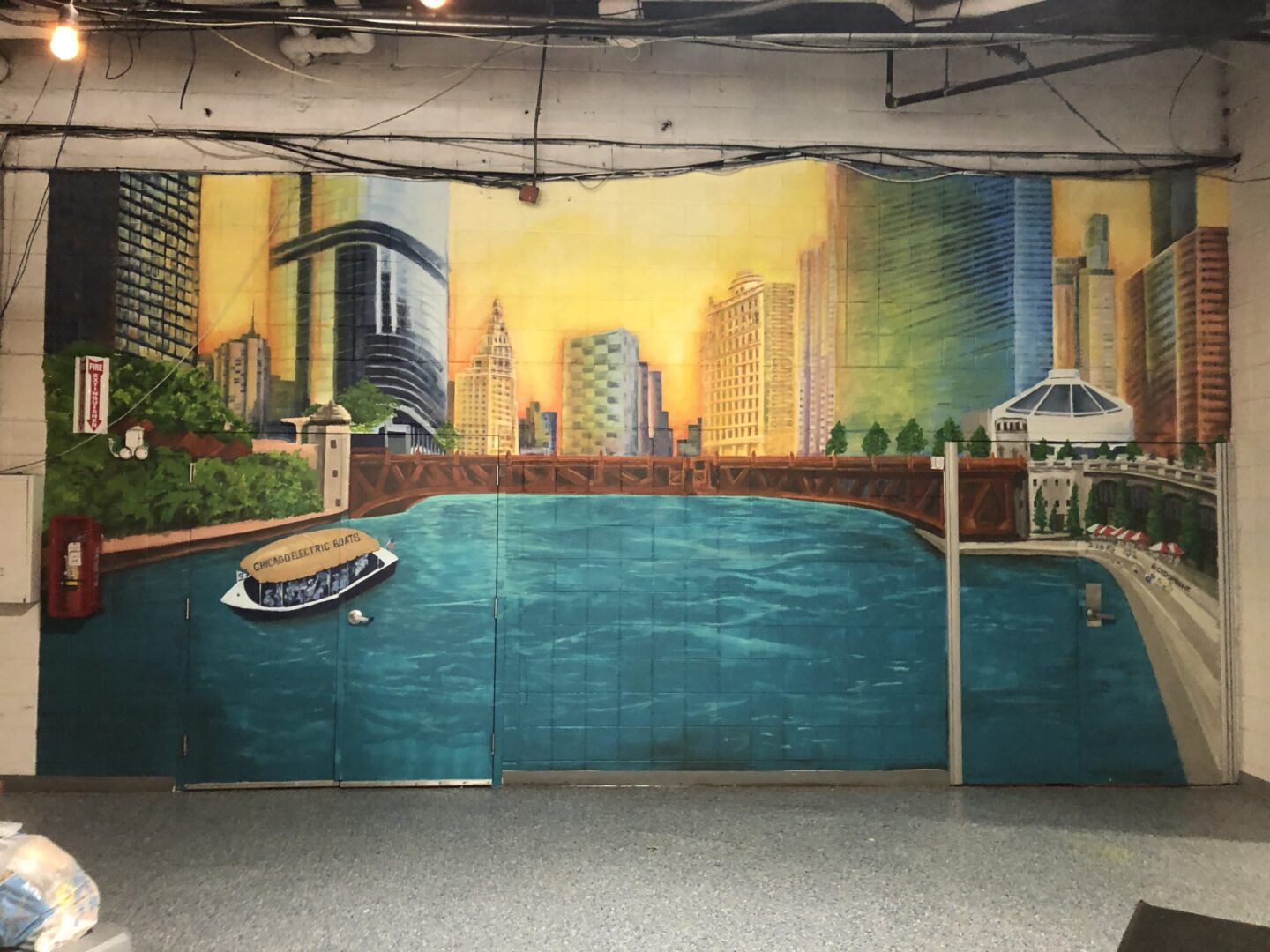 A city and a lake painted on a wall