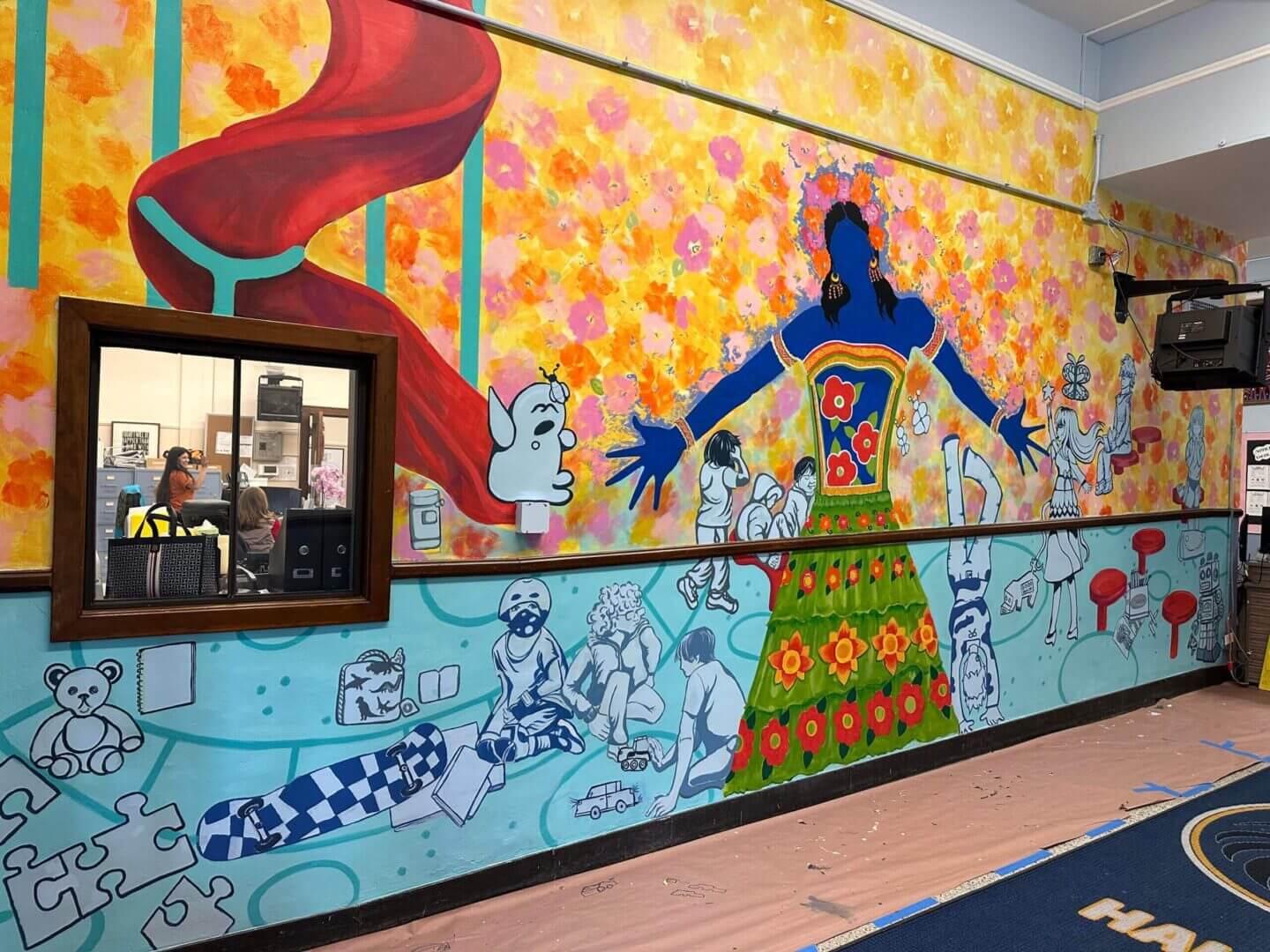 Colorful mural with diverse cartoon characters.